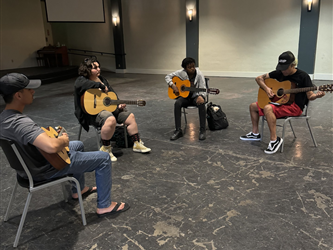 students playing guitar